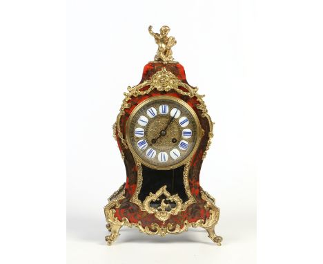 A French early 20th century boulle bracket clock. With gilt dial having enamel markers. Housing an eight day two train moveme