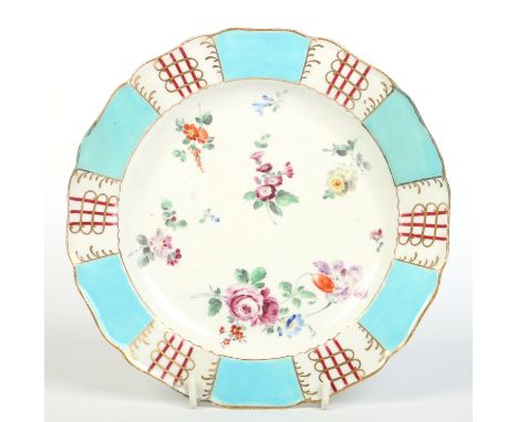 A Worcester plate with a panelled border of turquoise, claret and gilt enamelled to the centre with scattered sprigs. C1770, 