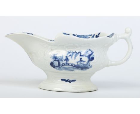 A small Worcester silver shaped sauceboat. Painted in underglaze blue with the Sinking Boat Fisherman pattern. Workman's mark