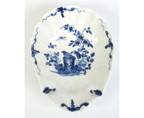 A Worcester shell moulded pickle dish. Painted in underglaze blue with the Two Peony Rock Bird pattern. Workman's mark c1758,
