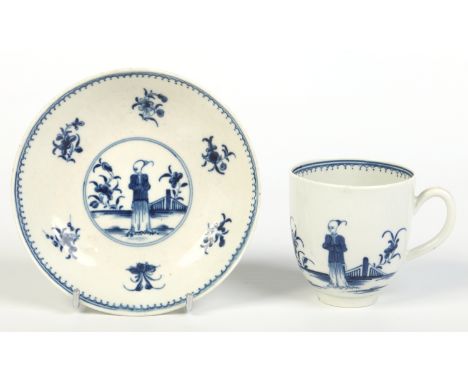 A Worcester coffee cup and saucer with grooved loop handle. Painted in underglaze blue with the Waiting Chinaman pattern. Ope