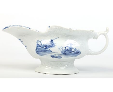 A large rare Worcester silver shaped sauceboat with moulded cartouches and C scroll handle with thumb rest. Painted in underg