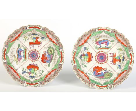 A pair of Worcester fluted plates. Enamelled in mock Oriental style with the Dragon in Compartments pattern. c1770, 22cm wide