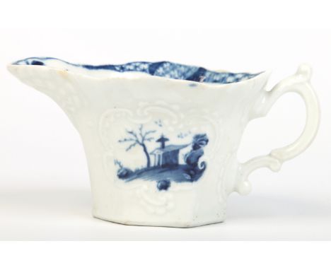 A Worcester flared hexagonal cream boat with double scrolling handle and moulded geranium leaf spout. Painted in underglaze b