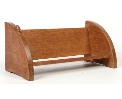 A Robert "Mouseman" Thompson Yorkshire oak book trough. With quarter round end supports, one carved with the mouse motif, 45.