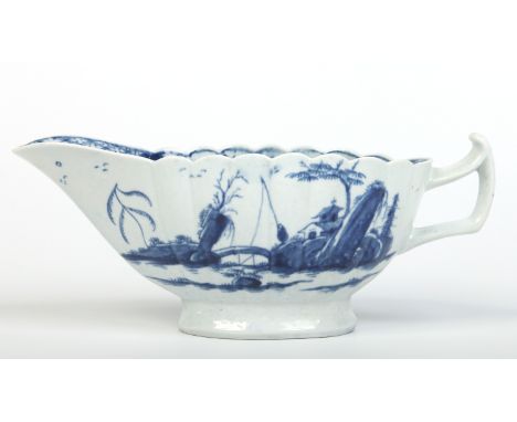 A large Worcester fluted sauceboat with upturned handle. Painted in underglaze blue with the Fringed Tree pattern. Workman's 