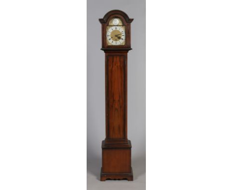 A walnut cased eight day Westminster Grandmother clock with brass arch top dial and silvered chapter ring, 170cm. 