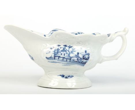 A Worcester silver shaped sauceboat with waved rim and scroll moulding. Painted in underglaze blue with the Triangular Platfo