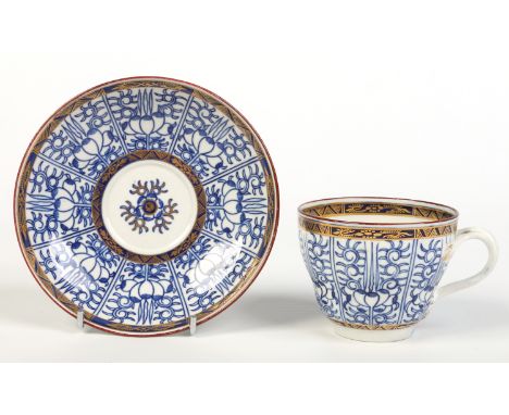 A Worcester tea cup and saucer of ogee shape and with entwined handle. Painted in underglaze blue with the Royal Lily pattern