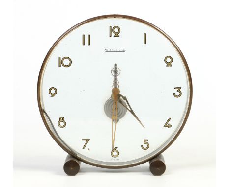 A Jaeger Le Coultre circular mantel clock with skeleton movement floating in a perspex case, 19.5cm high. Condition Report. T