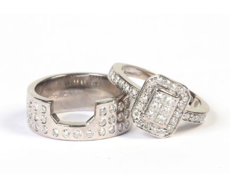 A pair of 18 carat white gold bridal engagement and interlocking wedding bands. Each set with rows of brilliant cut diamonds.