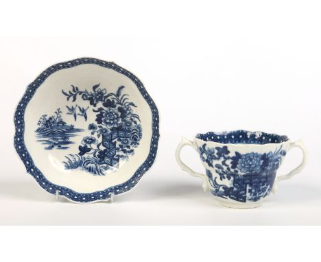 A Worcester chocolate cup and saucer. Printed in underglaze blue with the fence pattern under a cell border. Crescent marks, 