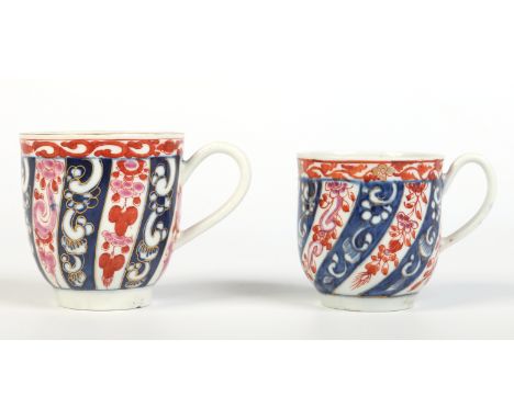 Two Worcester coffee cups with grooved loop handles decorated in the Queen Charlotte pattern. One with a workman's mark the o