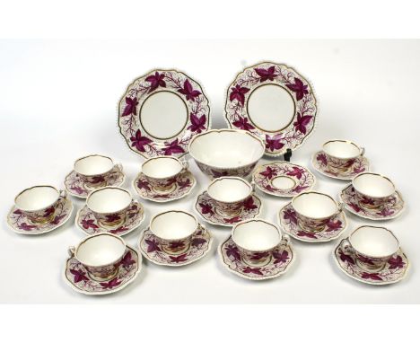 A Worcester Flight Barr & Barr twelve place teaset. With gardrooned moulded rims, gilded and enamelled in puce with trailing 