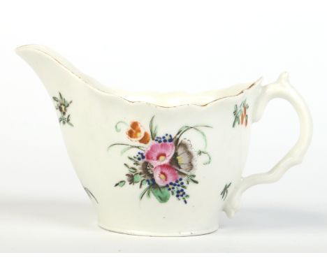A Worcester low ewer with scrolling handle and painted in coloured enamels with a bouquet and scattered sprigs. C1780, 6.75cm