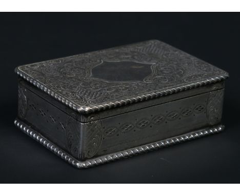 A 19th century Continental white metal table snuff box. With gardrooned borders and engraved with flowers and scrolls, 8cm wi