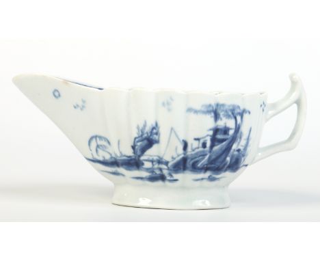 A Worcester fluted sauceboat with upturned handle. Painted in underglaze blue with the Fringed Tree pattern. Workman's mark c