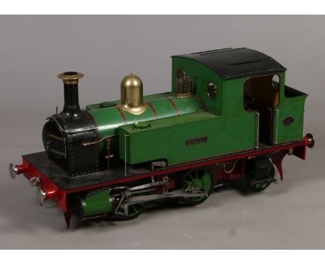 A 7" gauge live steam 0-4-2 tank engine and passenger carriage. In green livery and named Bridget. Constructed by T. W. Johns