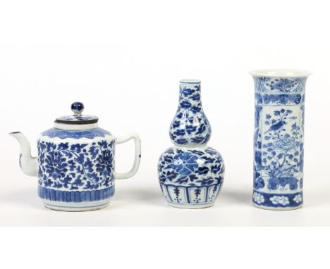 A 19th century Chinese teapot and cover and two similar vases, one a small sleeve vase and the other double gourd in shape. A