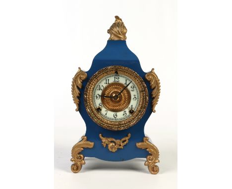 A painted Ansonia mantel clock in the French style. With gilt metal mounts, enamel chapter ring and housing and eight day twi
