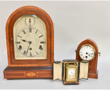 A German Mahogany Inlaid Chiming Table Clock, 37.5cm, a mahogany inlaid mantel timepiece 21cm high and a brass alarm carriage