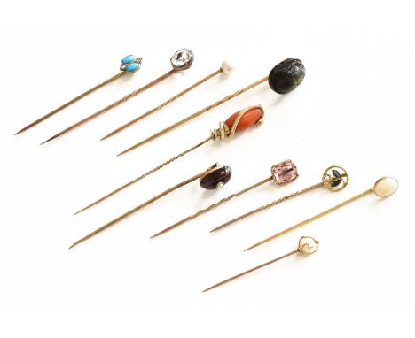 Ten Stickpins, including a coral and turquoise snake example, a garnet and split pearl example, a diamond and turquoise examp