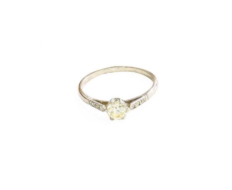 A Diamond Solitaire Ring, the old cut diamond in a white claw settings, to diamond set shoulders, on a plain polished shank, 