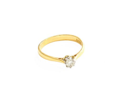 A 22 Carat Gold Diamond Solitaire Ring, the round brilliant cut diamond in a white claw setting, to a yellow tapered shoulder