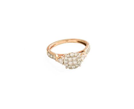 A 9 Carat Gold Diamond Cluster Ring, four princess cut diamonds within a border of round brilliant cut diamonds, in white cla
