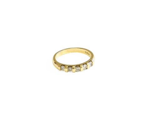 A 9 Carat Gold Diamond Five Stone Ring, the round brilliant cut diamonds in yellow bar settings, to a plain polished shank, f