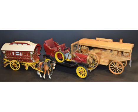 A scratch built model of a gypsy wagon installed with music box movement, 19cm high; another of an early 20th century motor c