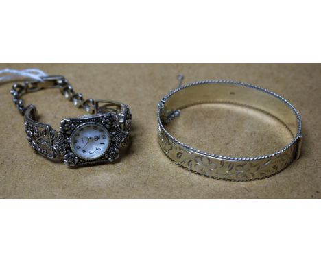 A 925 silver and marcasite wristwatch; a 925 silver bangle (2)