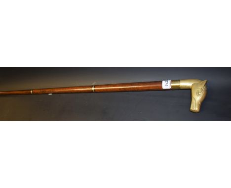 A novelty three section hardwood walking stick, the horses head concealing a provision for a phial, brass mounted, late 20th 