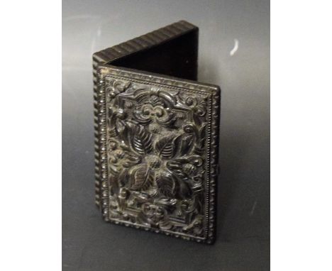 A snuff box, the hinged cover moulded with leafy scrolls