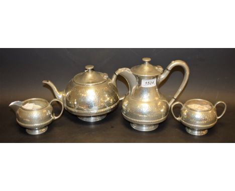 A James Dixon planished pewter tea service, including teapot, hot water jug, cream jug and sugar bowl (4)