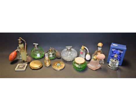 A Kigu musical compact; an Art Deco style perfume bottle; a cut crystal perfume bottle; others similar