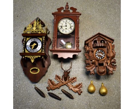 A Franz Hermle Atlas wall clock, mahogany case, gilt metal decoration with finial modelled as Atlas and globe, 2 tear drop we