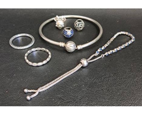 SELECTION OF PANDORA SILVER JEWELLERY comprising a slider bracelet, two rings - Sparkle & Hearts eternity and another eternit