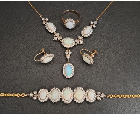 OPAL AND WHITE GEM SET SUITE OF JEWELLERYcomprising a necklace with opal and gem cluster drop below three further clusters, i