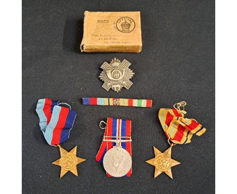 SET OF THREE WORLD WAR II WAR MEDALSincluding 1939-1945 War medal, 1939-1945 Star, Africa Star, Highland Light infantry cap b
