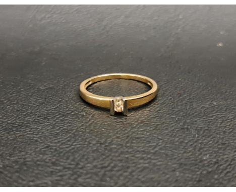DIAMOND SOLITAIRE RINGon fourteen carat gold shank, the tension set diamond approximately 0.05cts, ring size L-M and approxim