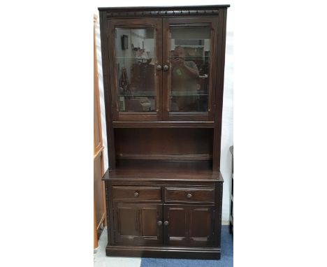ERCOL ELM MURAL OLD COLONIAL GLAZED BOOKCASE/DISPLAY CABINET the two door glazed unit with two glass shelves over two drawer 