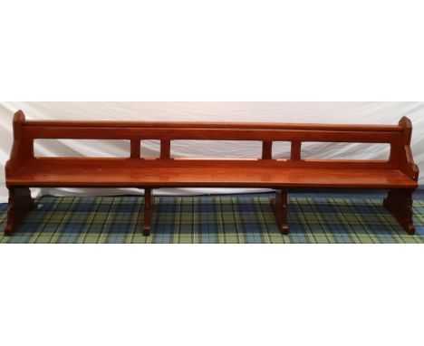 LARGE HEAVY OAK ARTS AND CRAFTS STYLE CHURCH PEWwith shaped ends and shelf under seat to rear, 304 x 85 x 46cm 