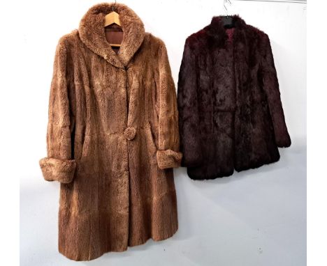 TWO VINTAGE FUR COATSthe shorter jacket a medium size, the longer coat a larger size 