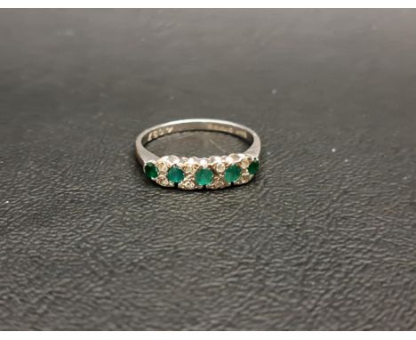 EMERALD AND DIAMOND RINGthe five graduated round cut emeralds separated by small diamonds, on eighteen carat white gold shank