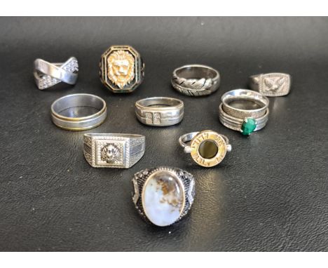 SELECTION OF TEN SILVER RINGSincluding a stone set spinner, two with gold detail, a dress ring with lion's head decoration, a
