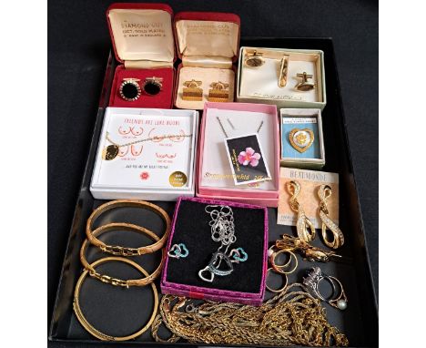 LARGE SELECTION OF GOLD PLATED JEWELLERYincluding a Victorian style CZ set bangle, other bangles, cufflinks, pendants, rings,