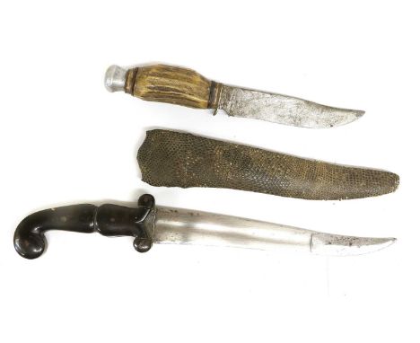 A 19th Century Indian Khanjar, the the 20cm slighlty curved double edge steel blade with swollen and reinforced tip, the bras