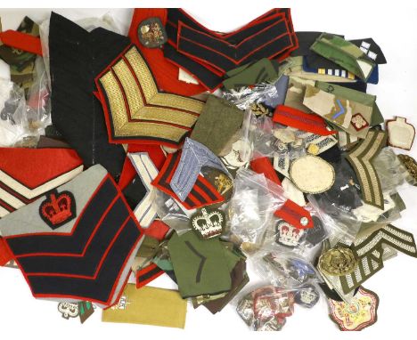 A Large Quantity of British Army Rank Badges, metal and cloth including two pairs of chain epaulettes to a Major and a Lieute