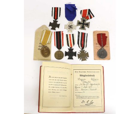 A Second World War German Faithful Service Cross, for 25 years; a 1939 Iron Cross, second class, the suspender ring stamped 5